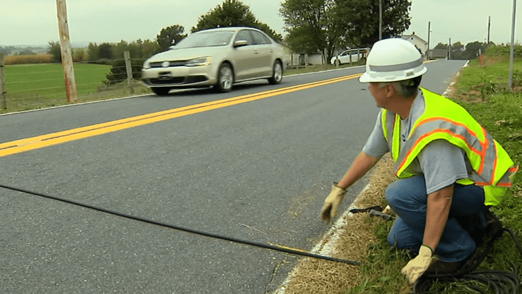 Man installing road tube